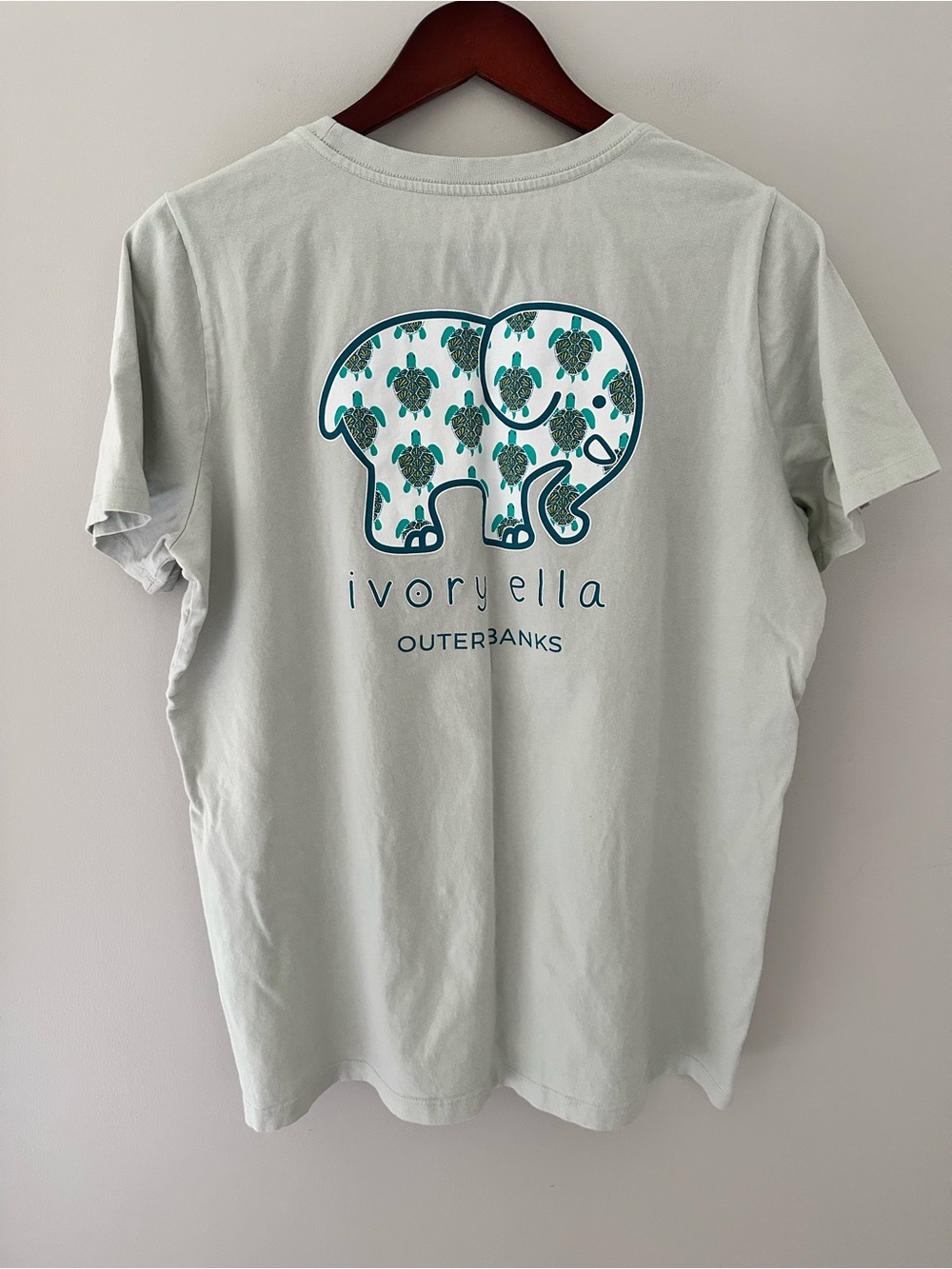 Ivory Ella OBX Light Sage Pocket Tee with Elephant Logo and Sea Turtles